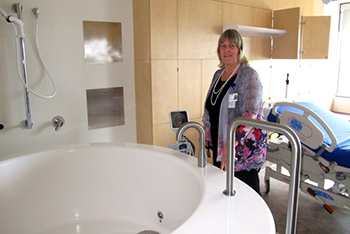 NNSW Richmond Clarence Health Service Group GM Lynne Weir with one of the five large-capacity birthing baths in the new Women’s Care Unit.
