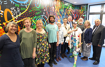 A range of local artists contributed works for the new Lismore Base Hospital Paediatric Unit that was officially opened on 8 September. Pictured with NSW Health Minister Brad Hazzard (rear) and State MP for Lismore Thomas George (right) were (l-r) Joanna Kambourian, Erica Gully, Beki Davies, Jeremy Austin, Jeni Binns, Dougal Binns, Malcom Austin, and Anne-Marie Mason. At the front is Dr Sniggle of the Clown Doctors.Other artists (not pictured) were Justin Livingston and Rachel Stone.