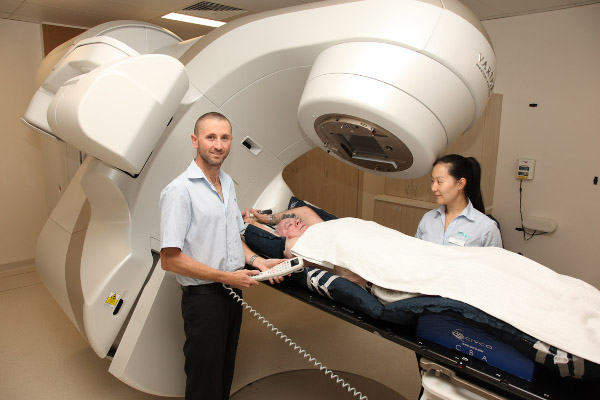 Radiation Therapists Matt Kelly and Joy Gu preparing to administer Stereotactic Ablative Body Radiotherapy to Mr William Wallace using the new TrueBeam™ linear accelerator.