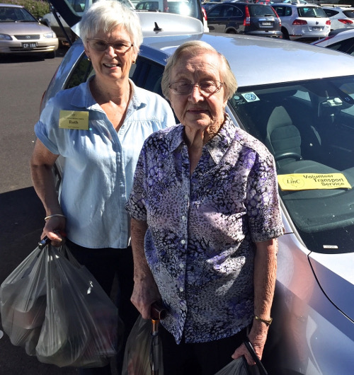 LinC volunteer Ruth Cook assisting Alstonville resident Christine Piling, aged 87, with her shopping.
