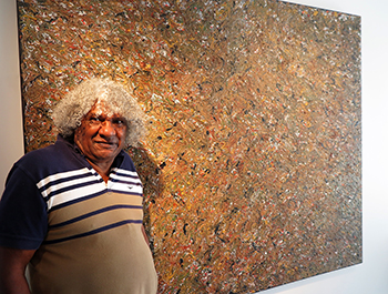 Bundjalung artist Digby Moran with Lismore Flood, one of the highlights of his ‘Growing up on the Island’ exhibition at Lismore Regional Gallery.